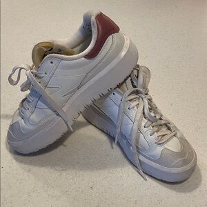 New Balance White Sneakers with Maroon-ish back accent.